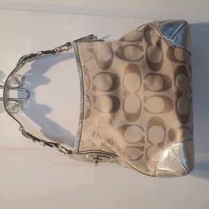 Silver and tan Coach handbag